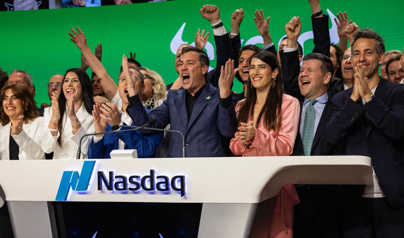Yoni Assia, co-founder and chief executive officer of EToro Group Ltd., center, and Ronen Assia, co-founder of EToro Group Ltd., center left, ring the opening bell during the company’s initial public offering at the Nasdaq MarketSite in New York, US, on Thursday, May 15, 2025.