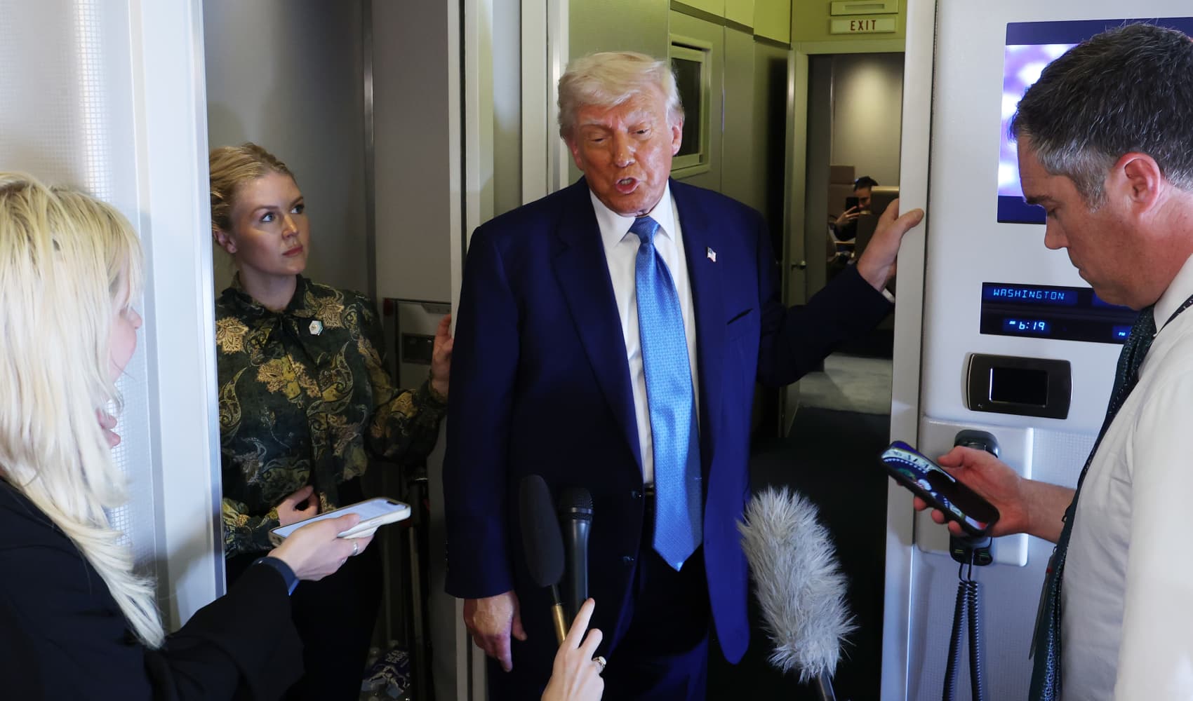 U.S. President Donald J. Trump speaks to media on Air Force One as he departs the Al Bateen Executive Airport on May 15, 2025, in Abu Dhabi, United Arab Emirates.